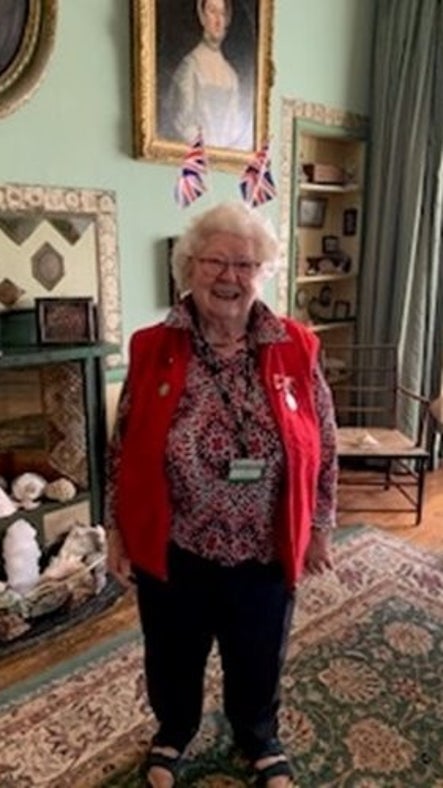 Gill Laws, volunteer stands in A la Ronde Drawing Room on Charles III coronation